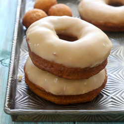 Homemade fried pumpkin yeast donuts with a sweet brown sugar maple glaze recipe from @bakedbyrachel