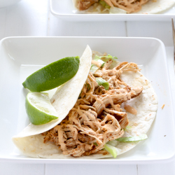 Easy slow cooker chicken tacos with spicy chipotle sour cream sauce recipe from @bakedbyrachel
