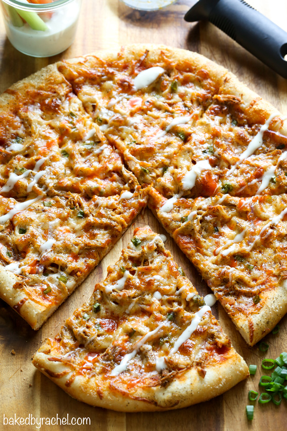 Thin crust four cheese spicy buffalo chicken pizza recipe from @bakedbyrachel A fun and super flavorful addition to any pizza night or game day menu!